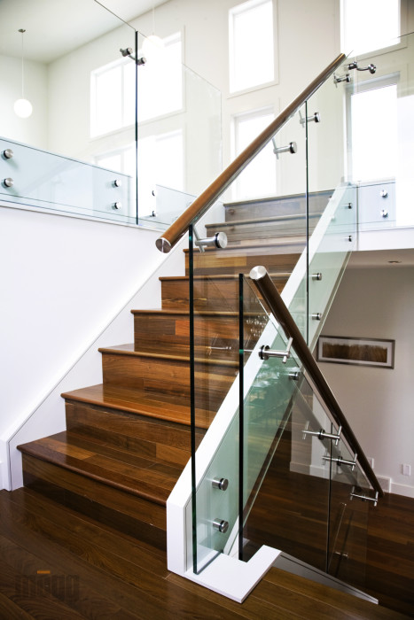 residential glass railing with wooden stairs